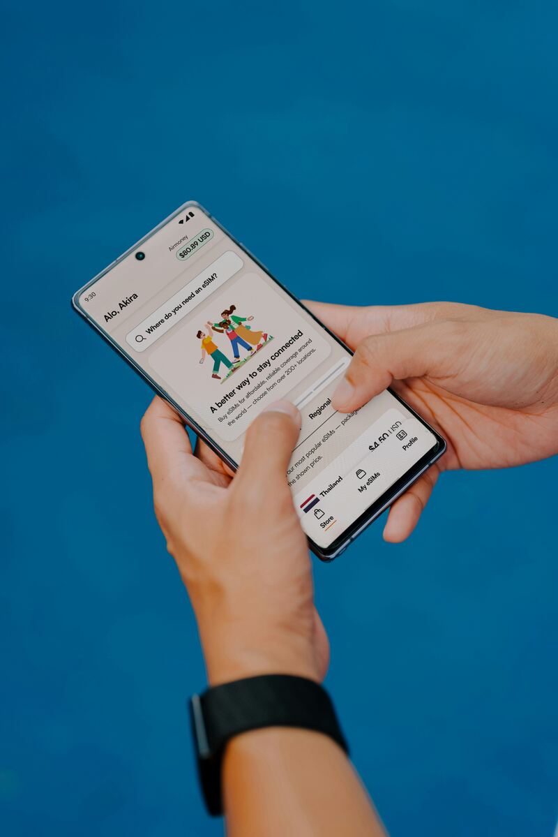 Person holding a smartphone to shop online